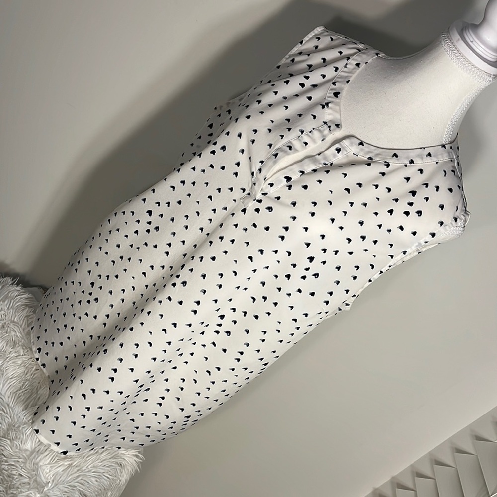 White V-neck blouse with black tiny hearts